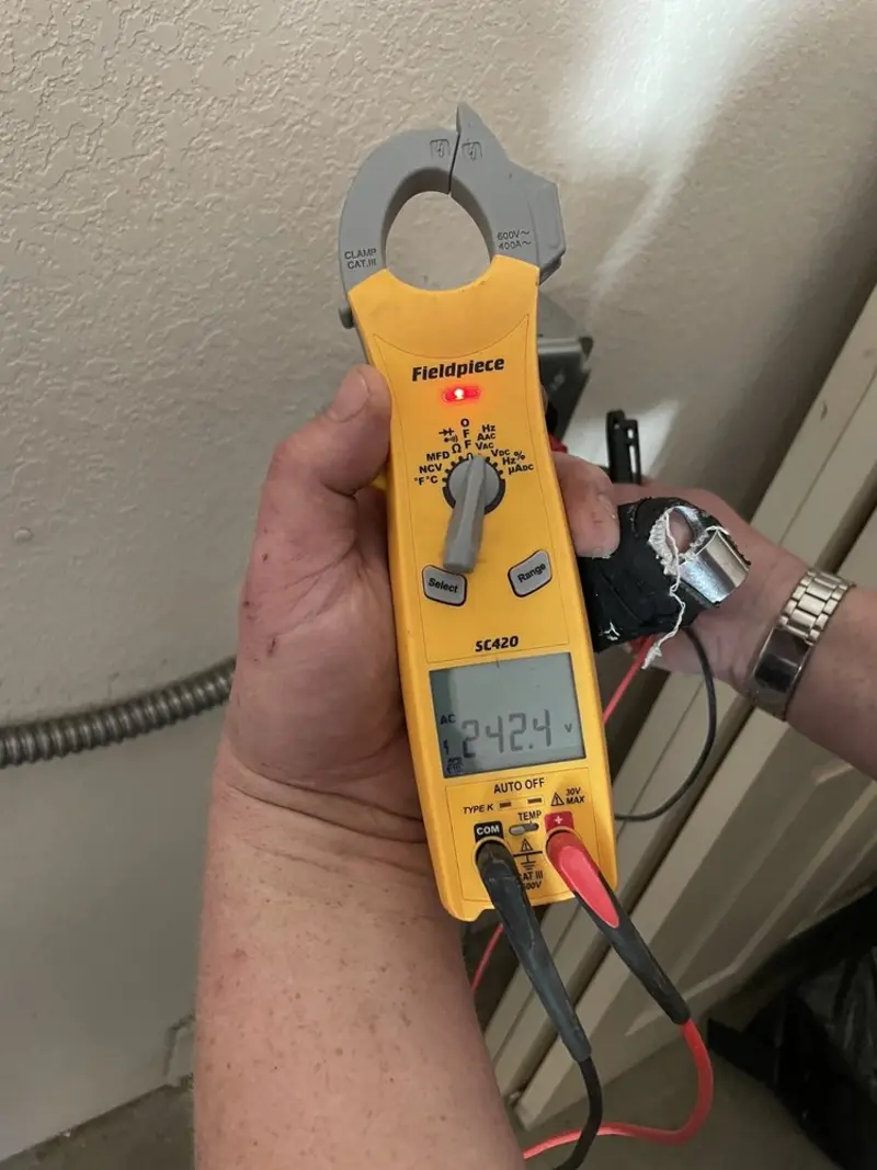 Voltage testing with clamp meter during Outlet Installation in Dewey-Humboldt